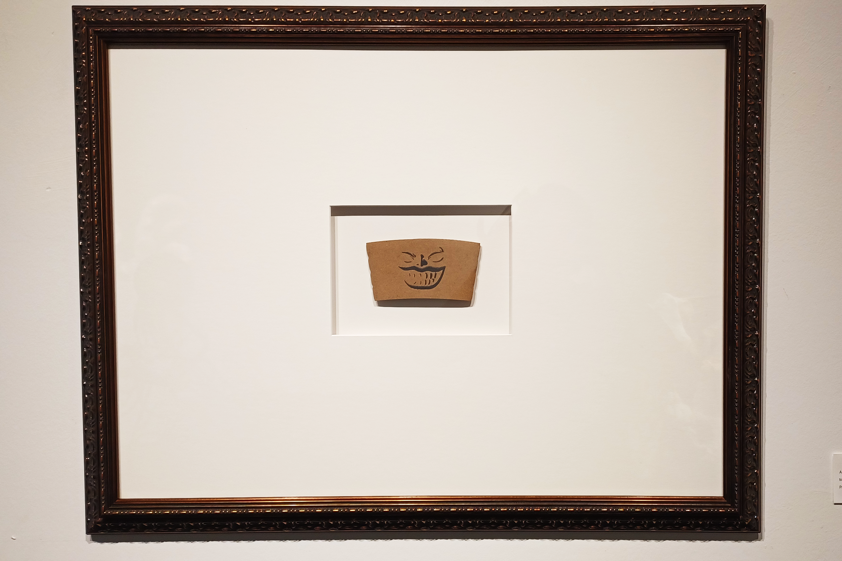 Framed print on coffee sleeve