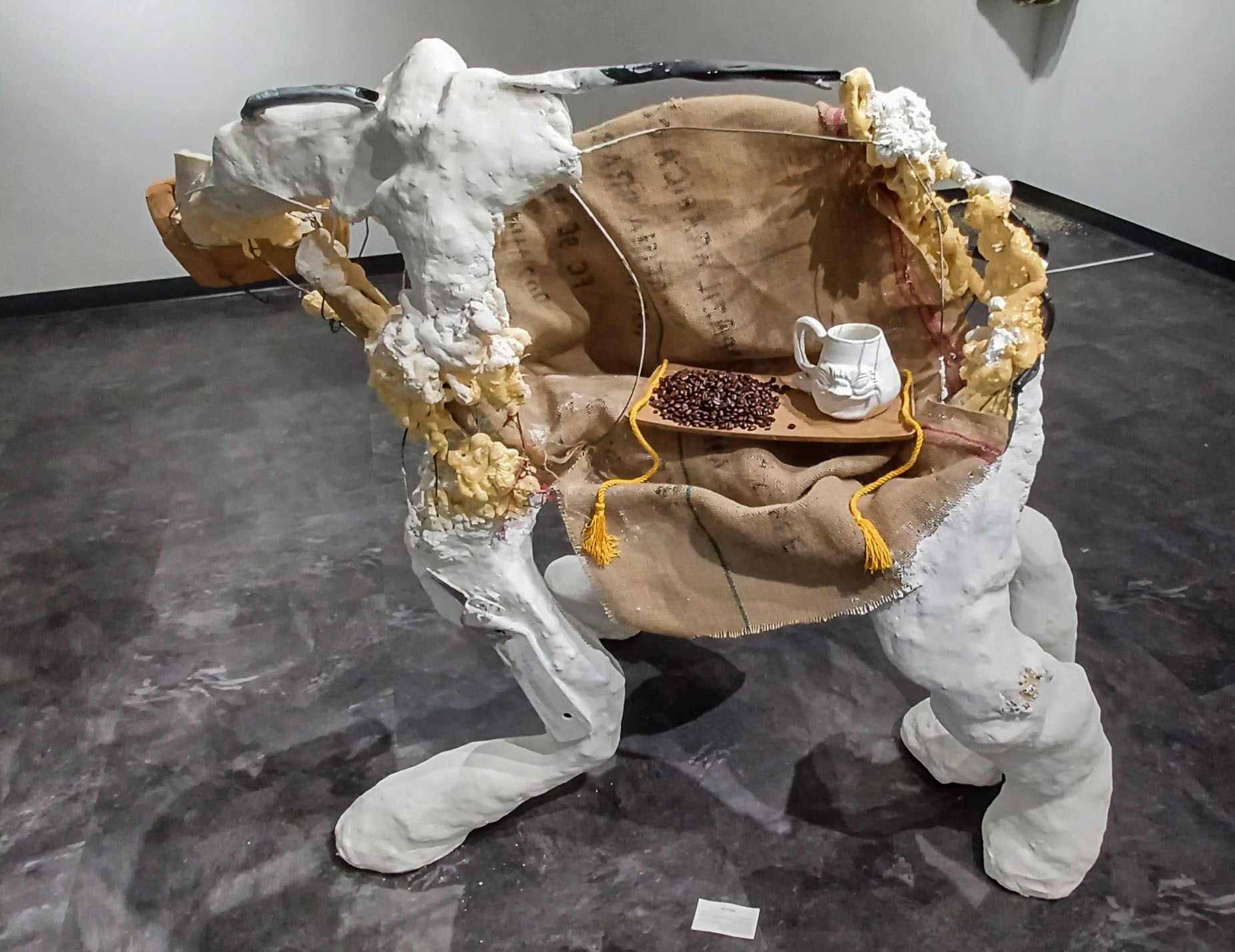 Four legged sculpture carrying coffee in stomach